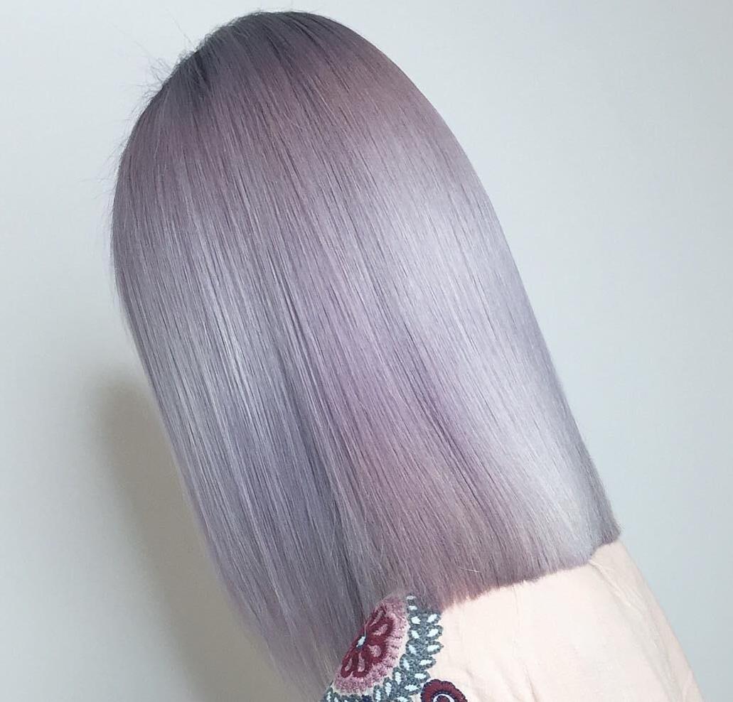 Woman with violet blonde bob