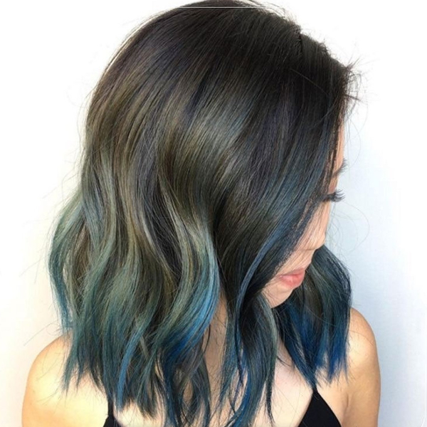 Image of woman with aqua hair created using Wella Professionals products