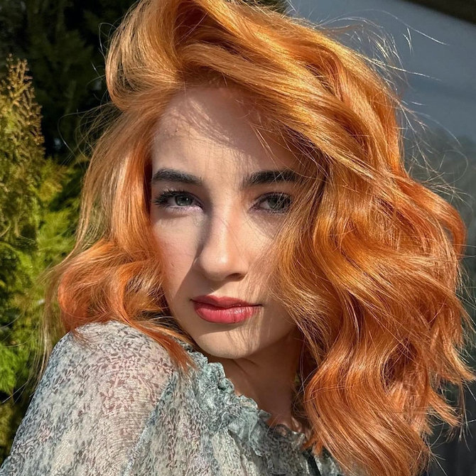 Golden copper blonde hair with a radiant, sunlit finish.