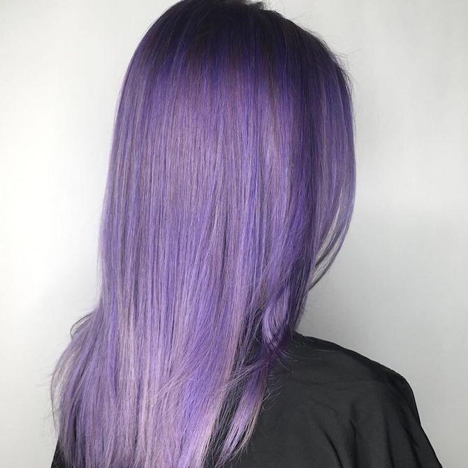 Back of womans head with long straight purple hair
