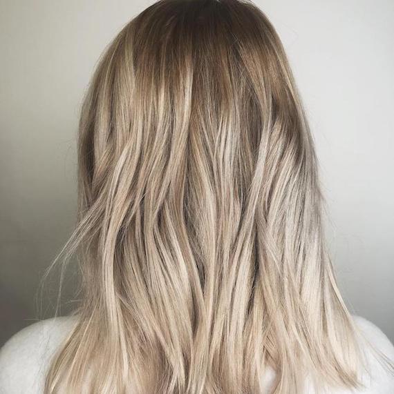 Photo of the back of a woman’s head with blonde babylights, created using Wella Professionals