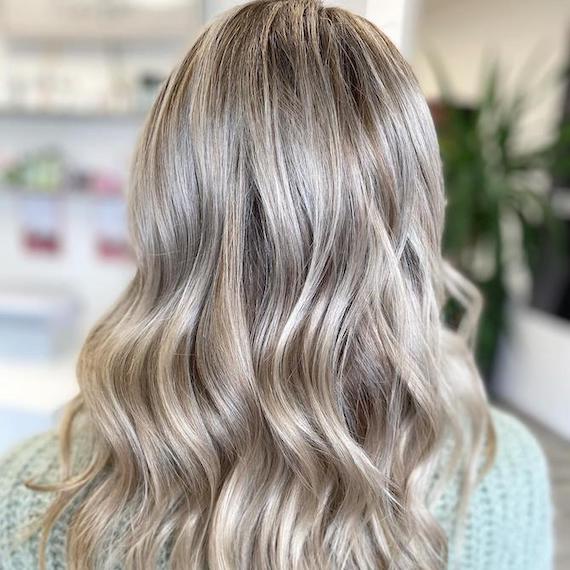 Back of woman’s head with ash blonde hair, created using Wella Professionals