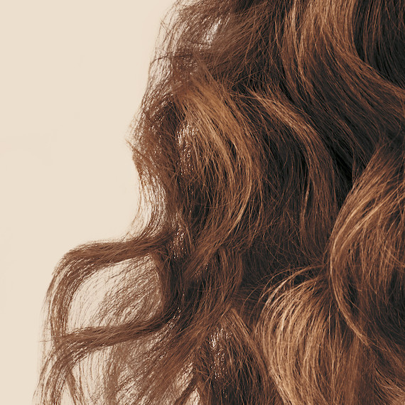 Close up of light brown type 2 wavy hair 