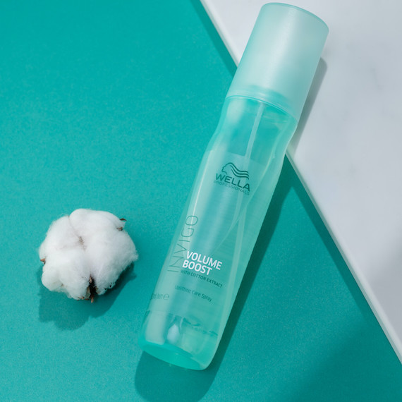 INVIGO Volume Boost Uplifting Hair Mist on a green background.