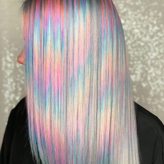 Side profile of a person with colorful holographic hair