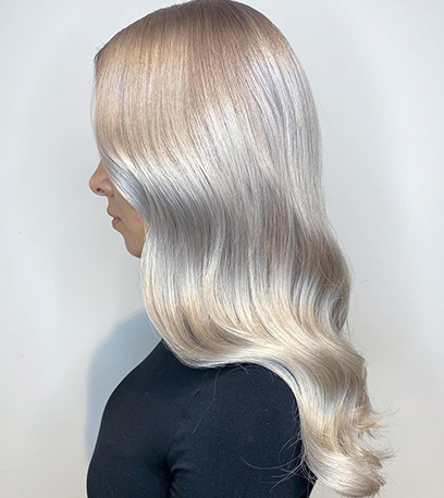 Side of luscious mother of pearl hair, created using Wella Professionals