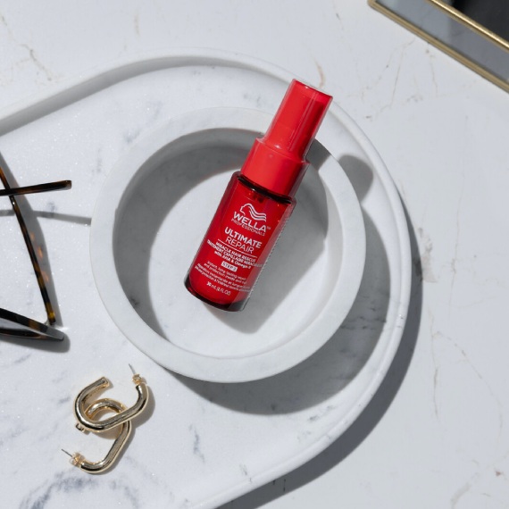 ULTIMATE REPAIR Miracle Hair Rescue on a marble surface.