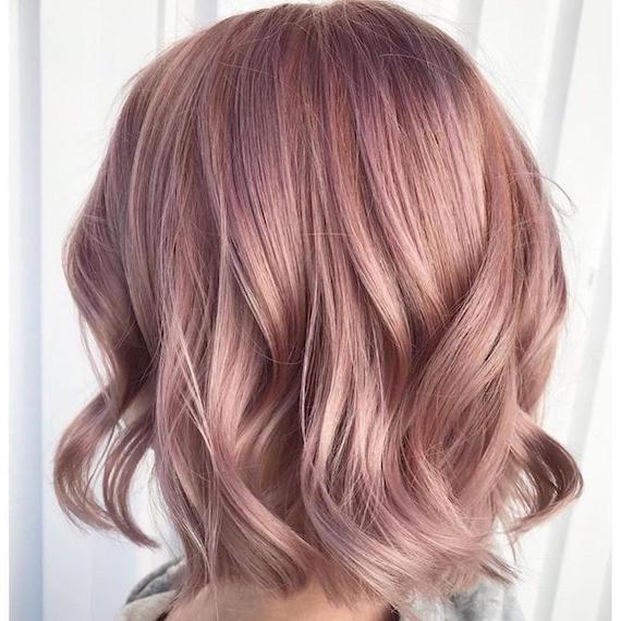 Back of woman’s head with pastel pink, wavy bob haircut, created using Wella Professionals.
