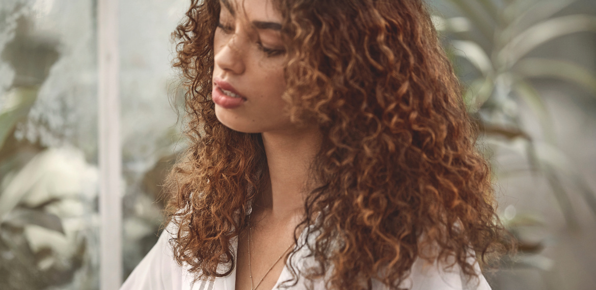 Model with curly hair, styled using Wella Professionals products