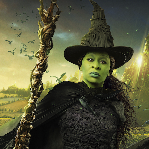 Cynthia Erivo appears as Elphaba, wearing a black witch hat and holding a broom.