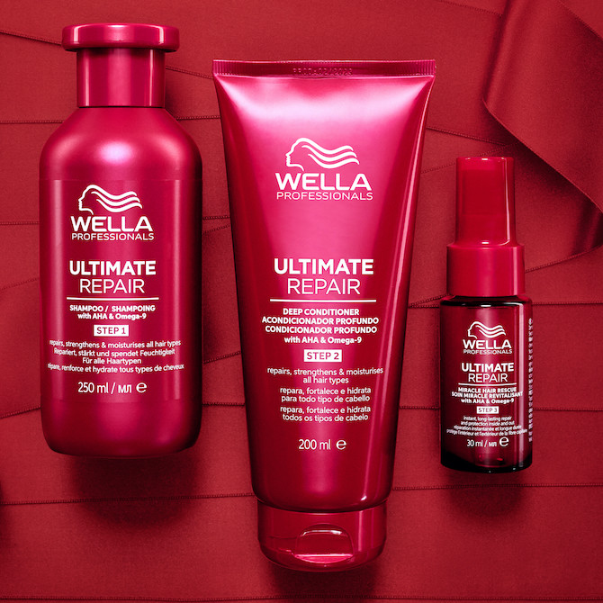 ULTIMATE REPAIR Shampoo, Conditioner and Miracle Hair Rescue against a backdrop of red ribbons.