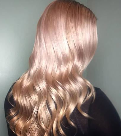 Woman with long wavy metallic hair created using Illumina Color