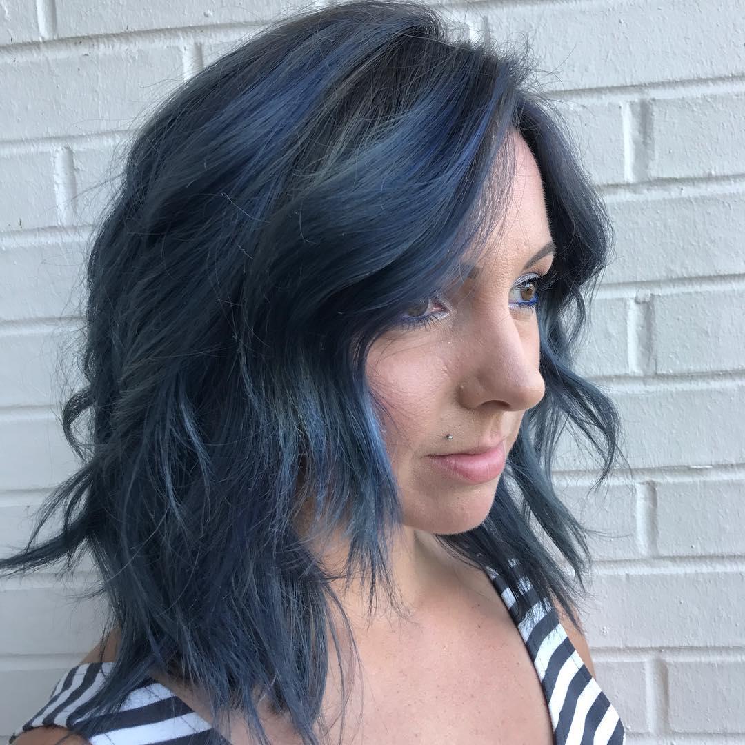 Image of woman with aqua hair created using Wella Professionals products