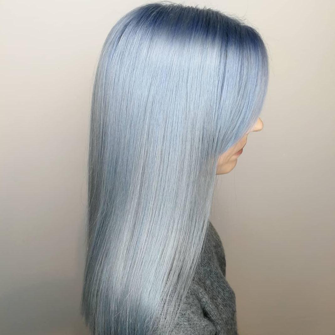 Image of woman with aqua hair created using Wella Professionals products