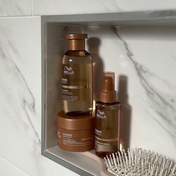 ULTIMATE SMOOTH Shampoo, Mask and Miracle Oil Serum in a marble bathroom.