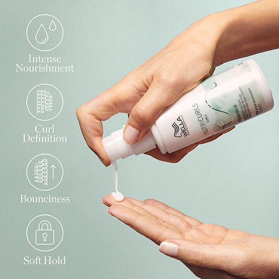 Model pumps NutriCurls Curlixir Balm into palm of hand.