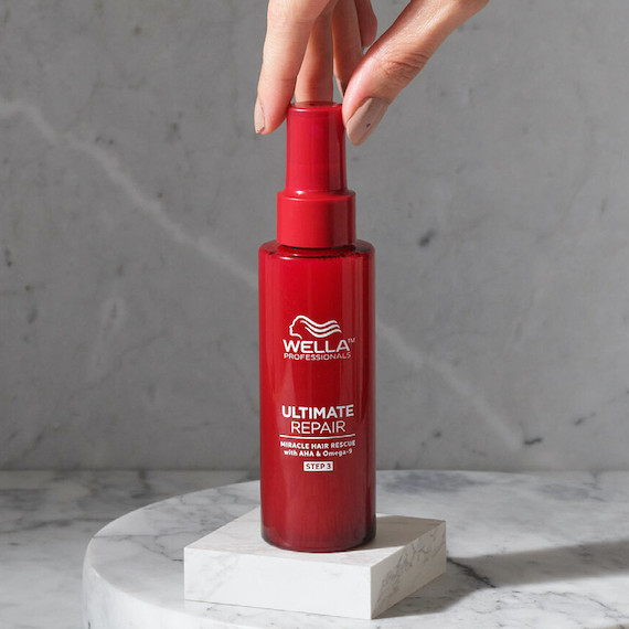 Wella Professionals Ultimate Repair Miracle Hair Rescue Treatment stood on a white marble surface