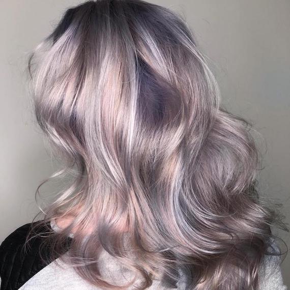 Back of woman’s head with mid-length, pastel blue and gray hair, created using Wella Professionals.