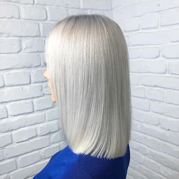 Woman with long, blonde bob, created using Wella Professionals