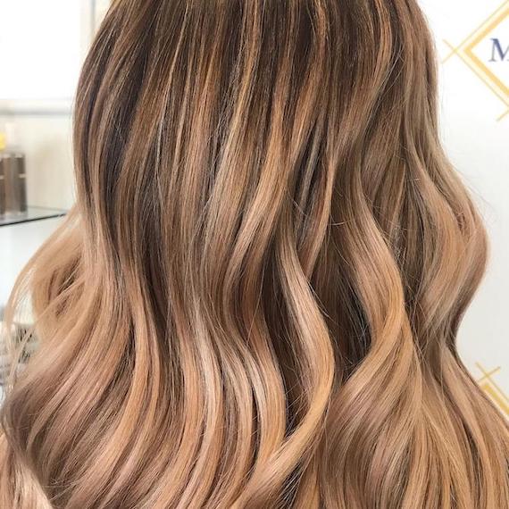 Back of woman’s head with light bronde hair, created using Wella Professionals.