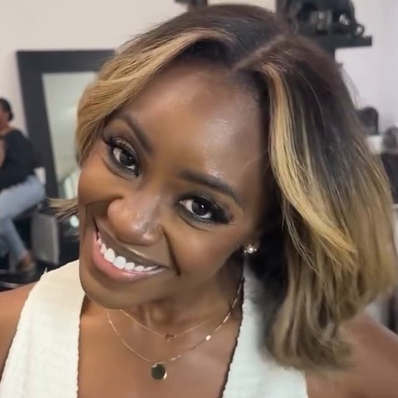 Dark brown hair with bold caramel face-framing highlights and a soft balayage.