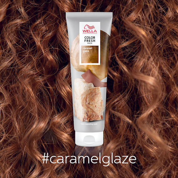 Bottle of Color Fresh Mask Caramel Glaze by Wella Professionals in front of curly hair