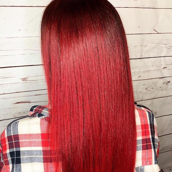 Photo of long, straight, cherry red ombre hair, created using Wella Professionals.