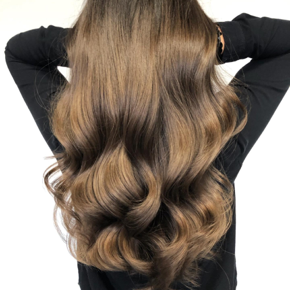 back of woman’s head with long,cool chestnut brown hair, created using Wella Professionals