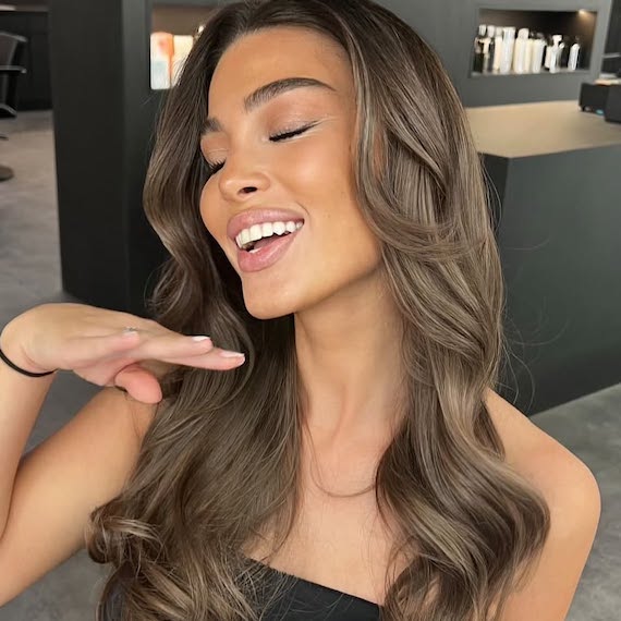 Ashy chocolate brown hair colour with cool undertones and soft balayage highlights.