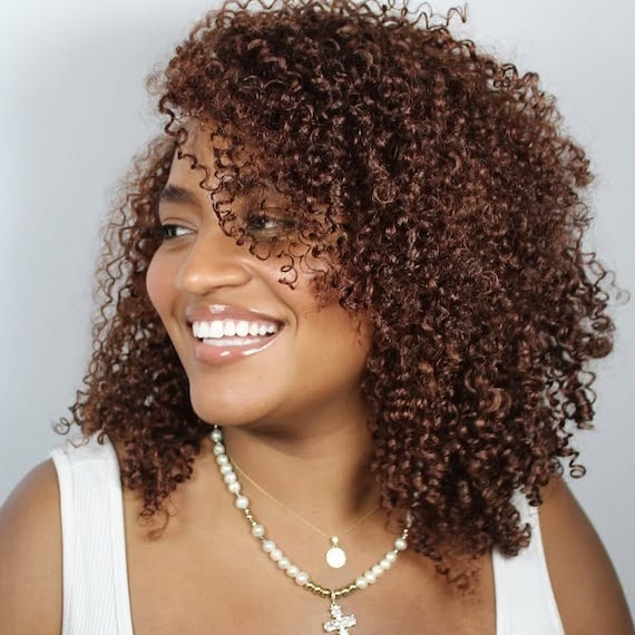 Chocolate cherry hair colour with a blend of red and brown tones for a warm, rich look.