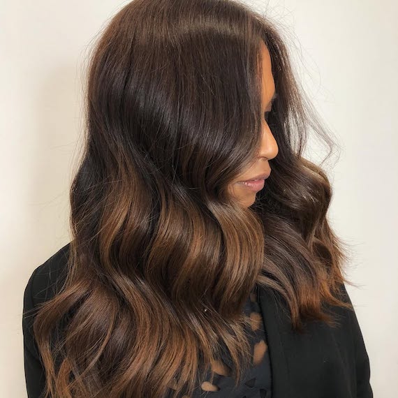 Grown-out balayage refreshed with a chocolate brown colour-depositing hair mask.
