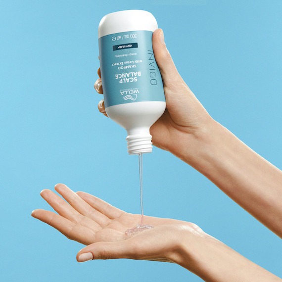 INVIGO Scalp Balance Deep Cleansing Shampoo is poured into hand.