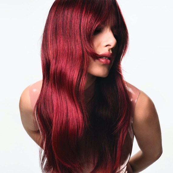 Model with long, glossy, cherry red hair.