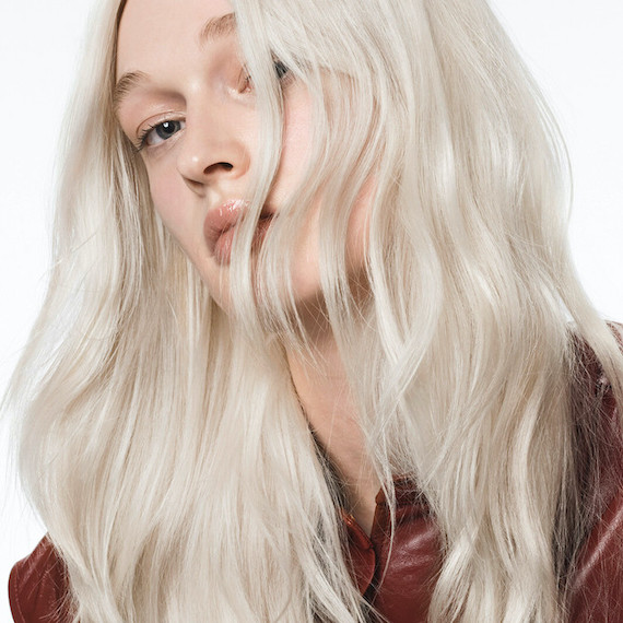 Model with long, loosely waved, icy blonde hair.