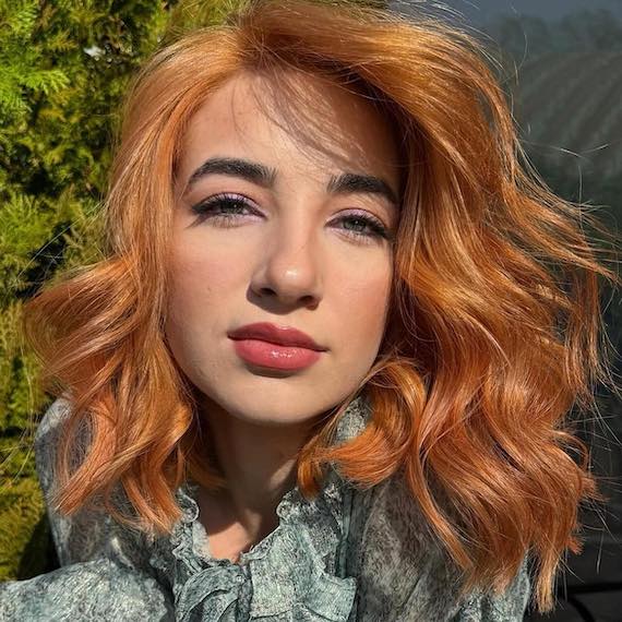 Golden copper blonde hair with a radiant, sunlit finish.
