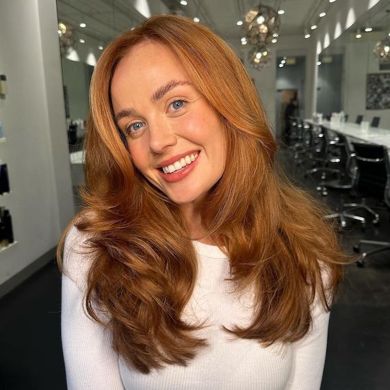 Auburn blonde hair with darker layers underneath and copper blonde on top.