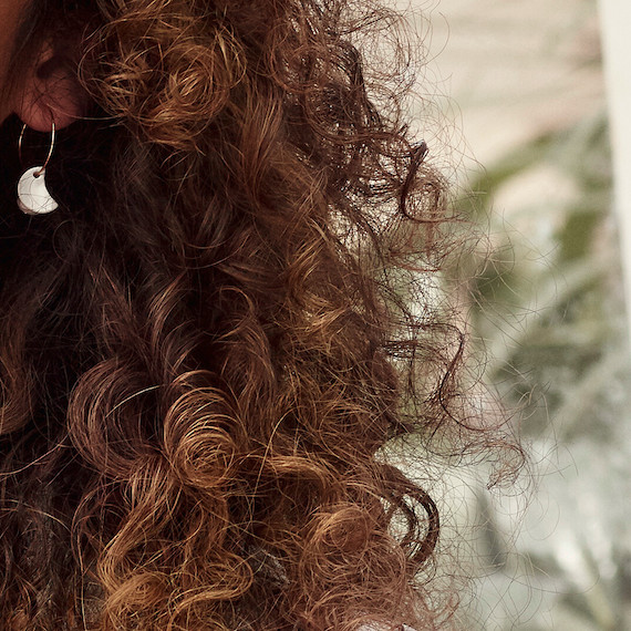 Close up of a section of brown, curly hair