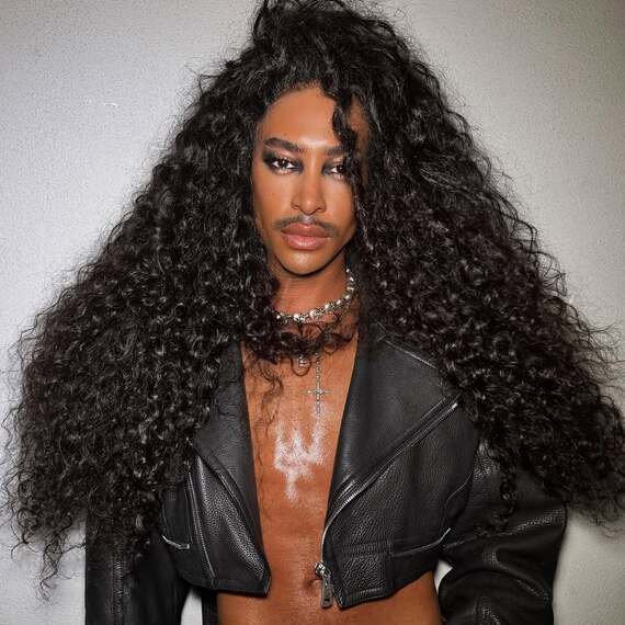 Model with long, dark brown, glossy curls.