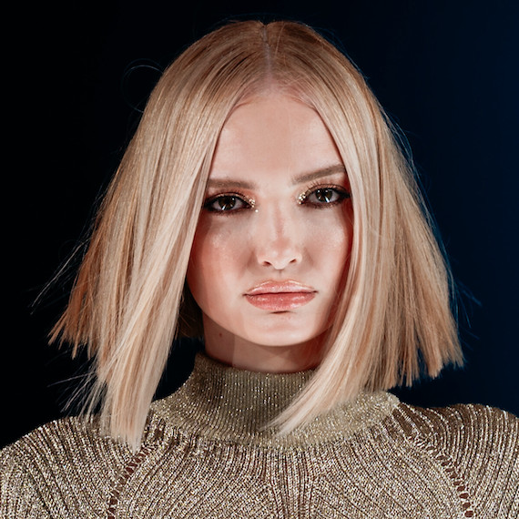 Model with choppy blonde bob haircut.
