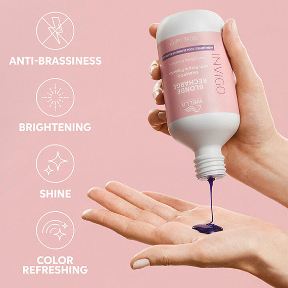 Model pours INVIGO Blonde Recharge Cool Blonde Shampoo into palm of hand.