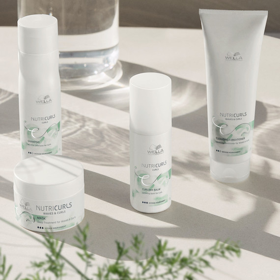 Collection of Wella NutriCurls products are on a white surface.