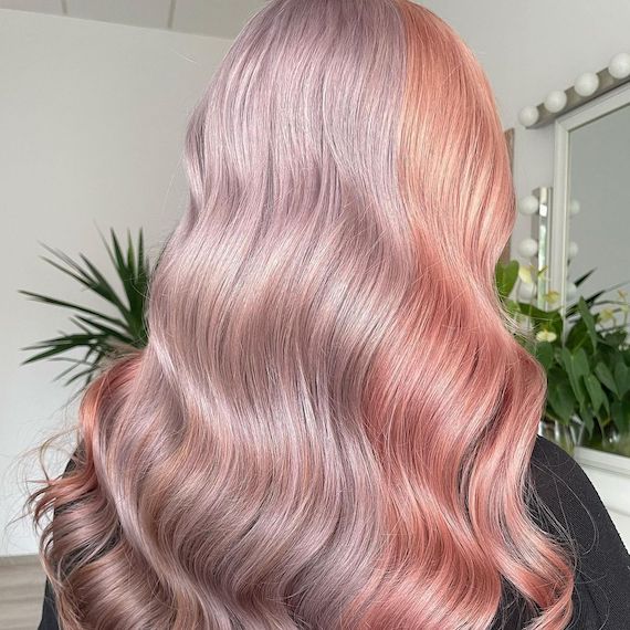 Model with pastel pink and lilac colour block hair.
