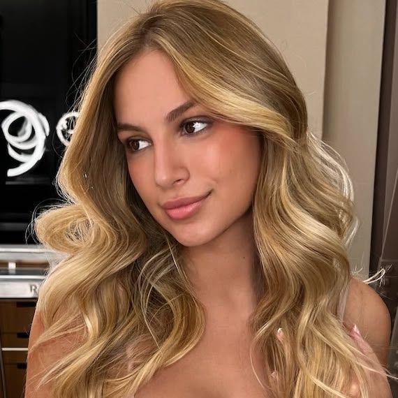 Honey blonde waves with soft dimension.
