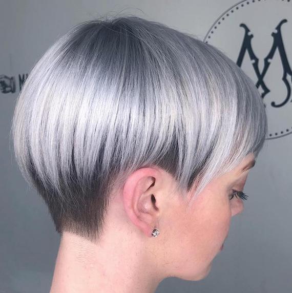 Side profile of woman with gray pixie cut hairstyle, created using Wella Professionals.