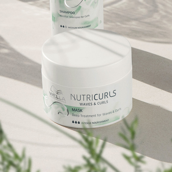 Jar of NutriCurls Deep Treatment on a white surface.