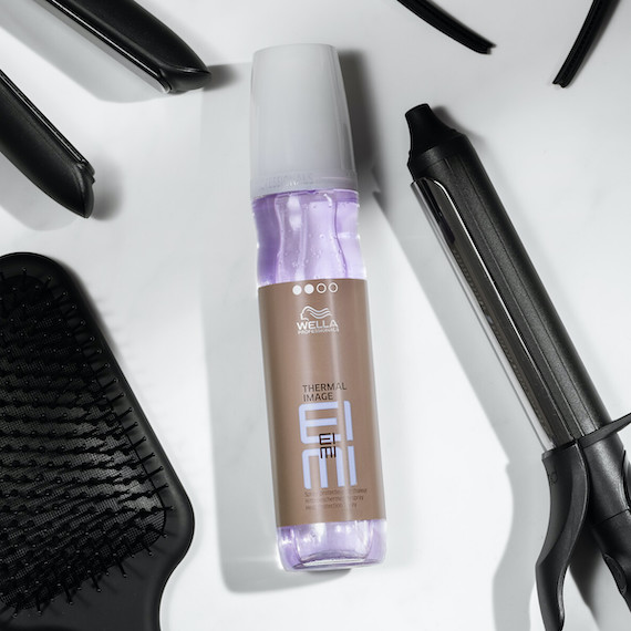 EIMI Thermal Image is surrounded by a selection of hair styling tools.