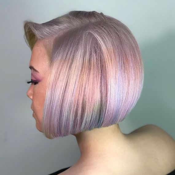 Side profile of a person with opal coloured hair and a bob hairstyle