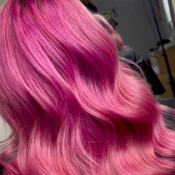 Close-up of model’s hot pink ombre hair.