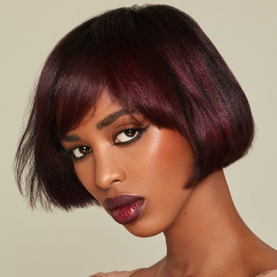Model with cherry chocolate, bob haircut.