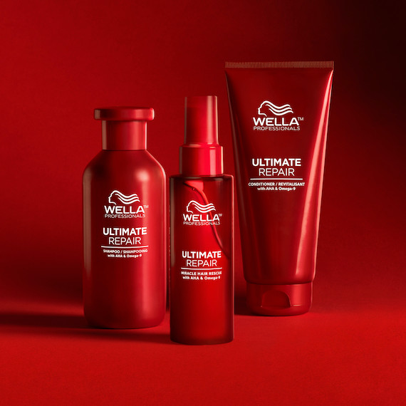 Ultimate Repair Shampoo, Conditioner and Miracle Hair Rescue on a red backdrop.